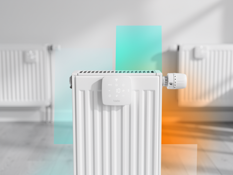tado Heizkörperthermostat angebracht an Wand mit App-Steuerung und Heizkörper im Hintergrund
